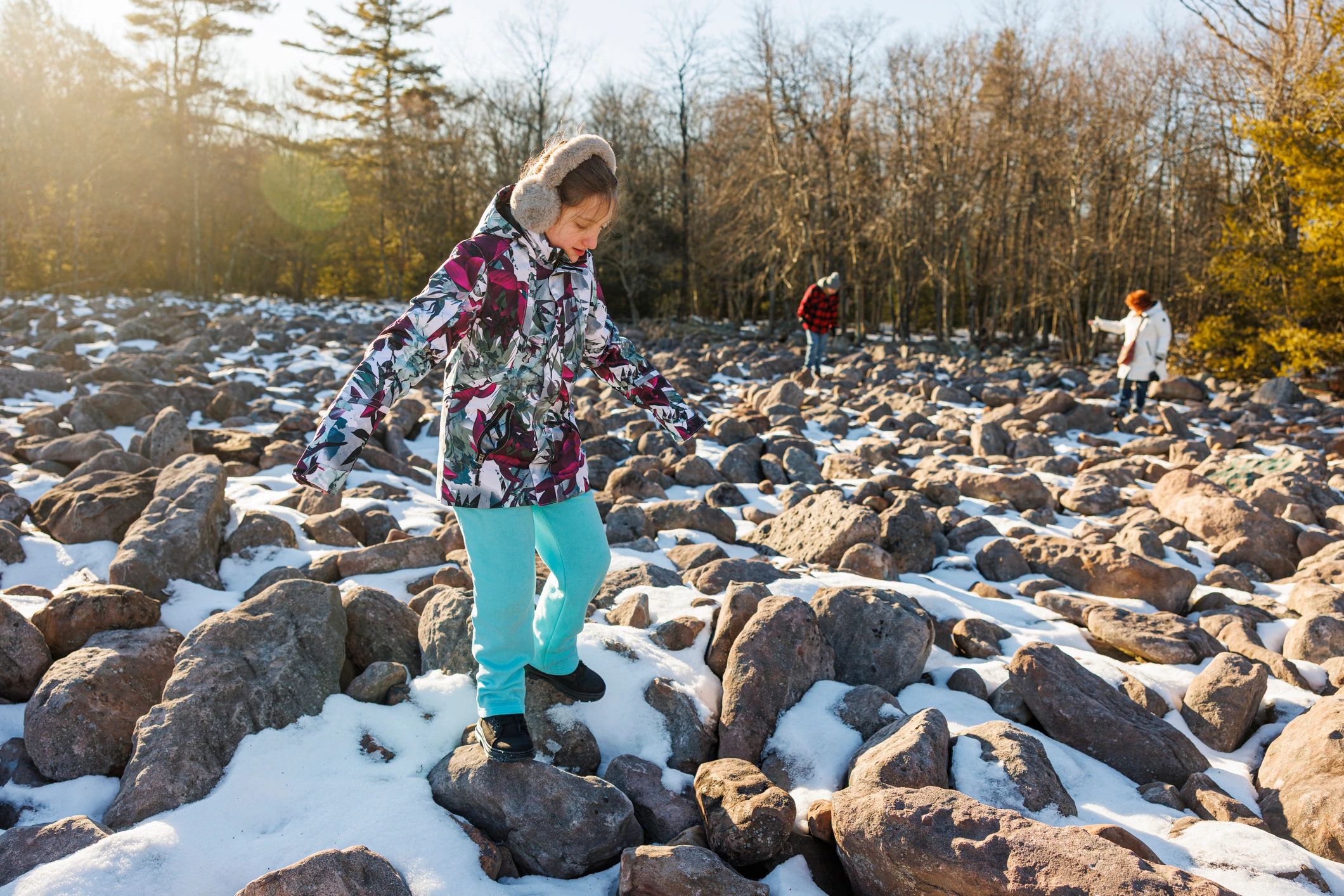 Family exploring a rocky wilderness landscape